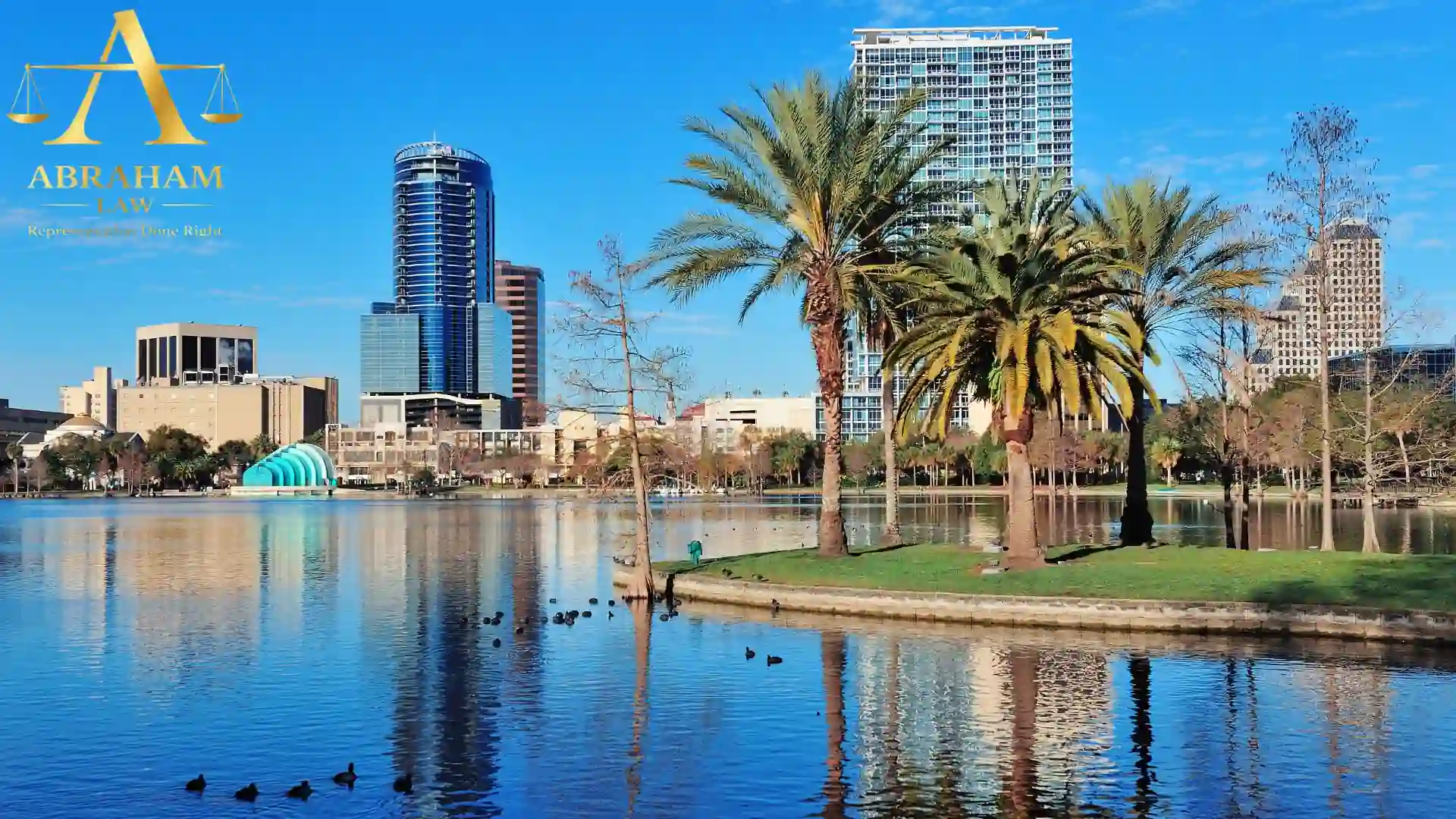 Urban lakefront with skyscrapers and palm trees in orlando
